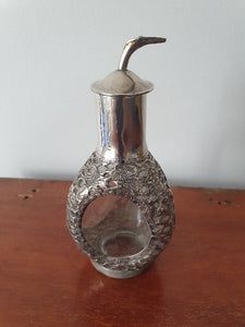 Antique Chinese Sterling Silver cased bitters bottle.