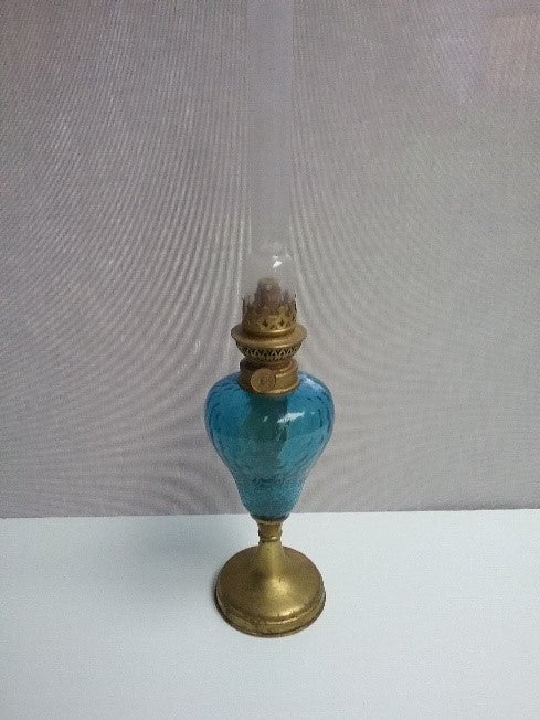 Brass and blue glass kerosene table lamp.